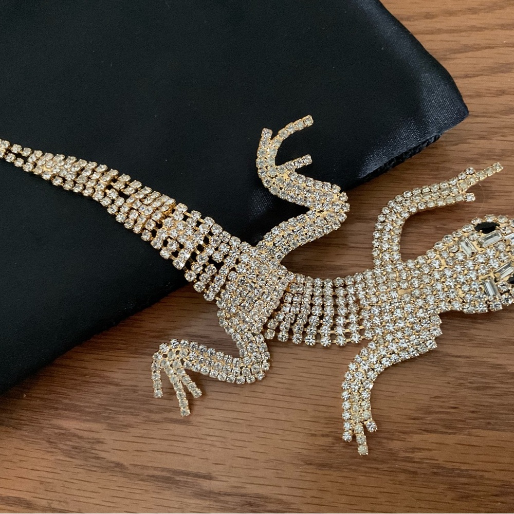 8” alligator pin, the tail flex’s, rhinestones, brand new